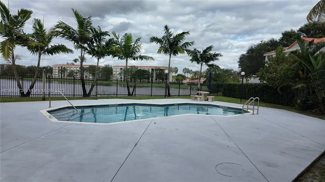 a view of a swimming pool with a patio