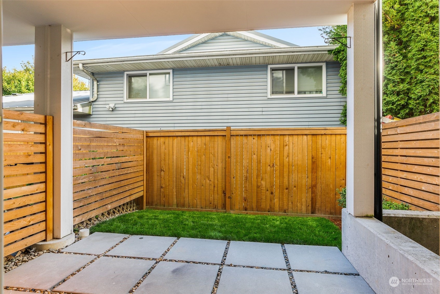3909 Southwest Findlay Street Seattle, WA 98136 - Photo 11 of 32 a side view of a house with a backyard