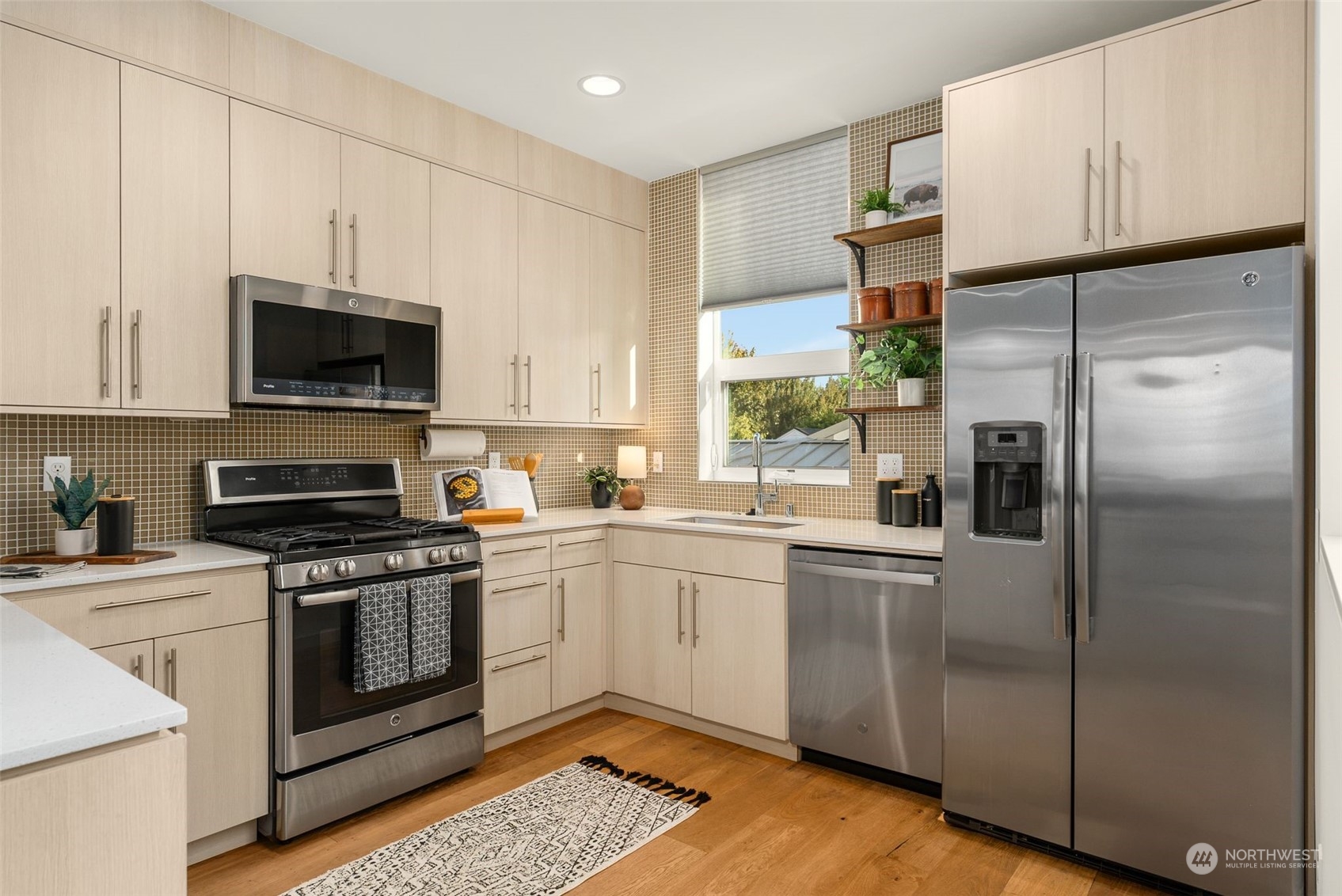 3909 Southwest Findlay Street Seattle, WA 98136 - Photo 12 of 32 a kitchen with a refrigerator stove and microwave