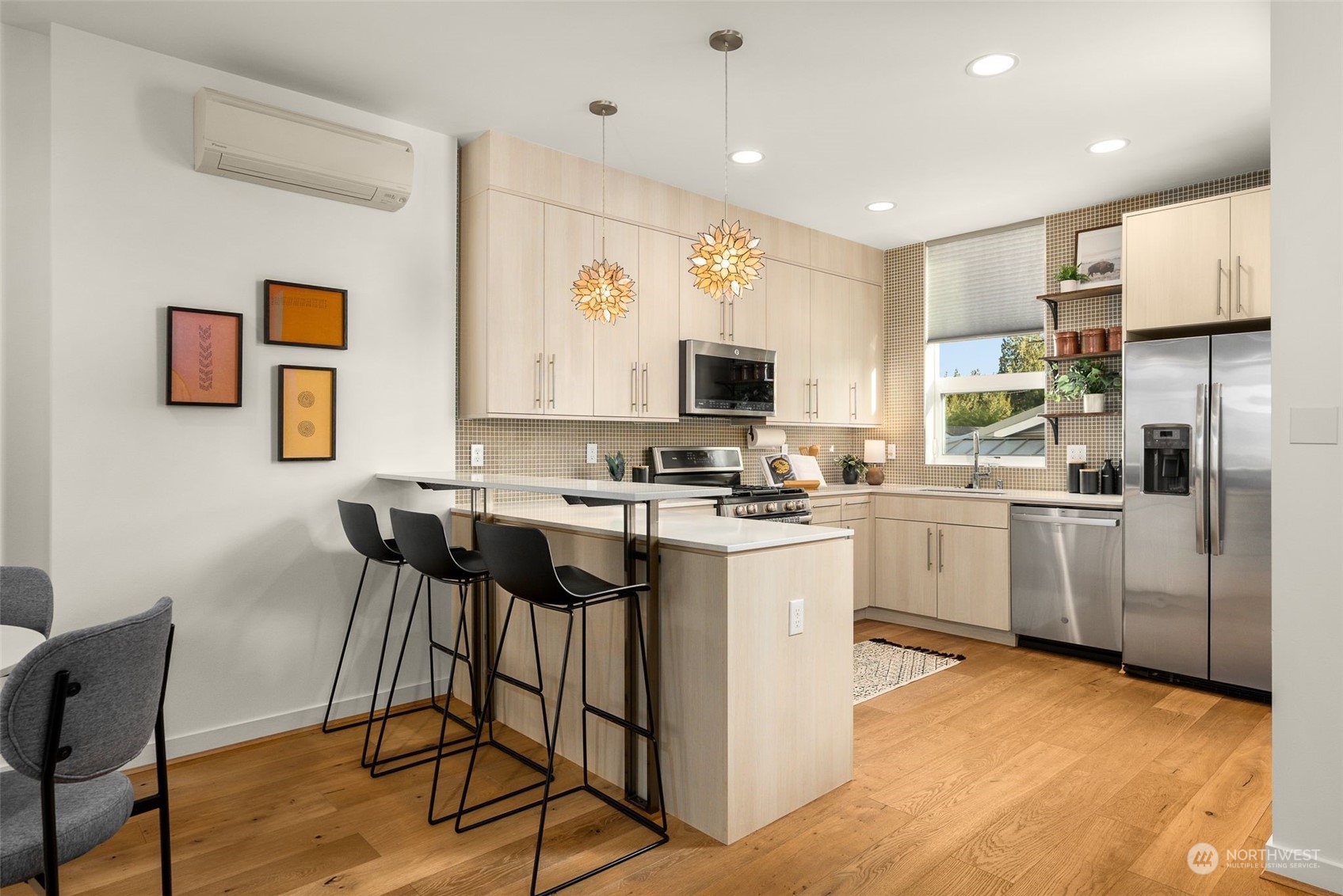 3909 Southwest Findlay Street Seattle, WA 98136 - Photo 13 of 32 a kitchen with white cabinets and appliances