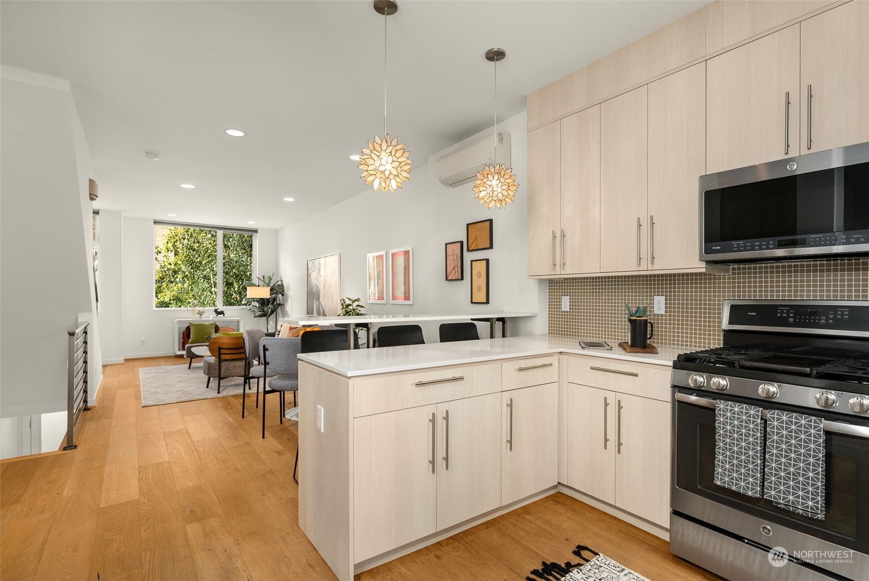 3909 Southwest Findlay Street Seattle, WA 98136 - Photo 15 of 32 a kitchen with a sink window and cabinets