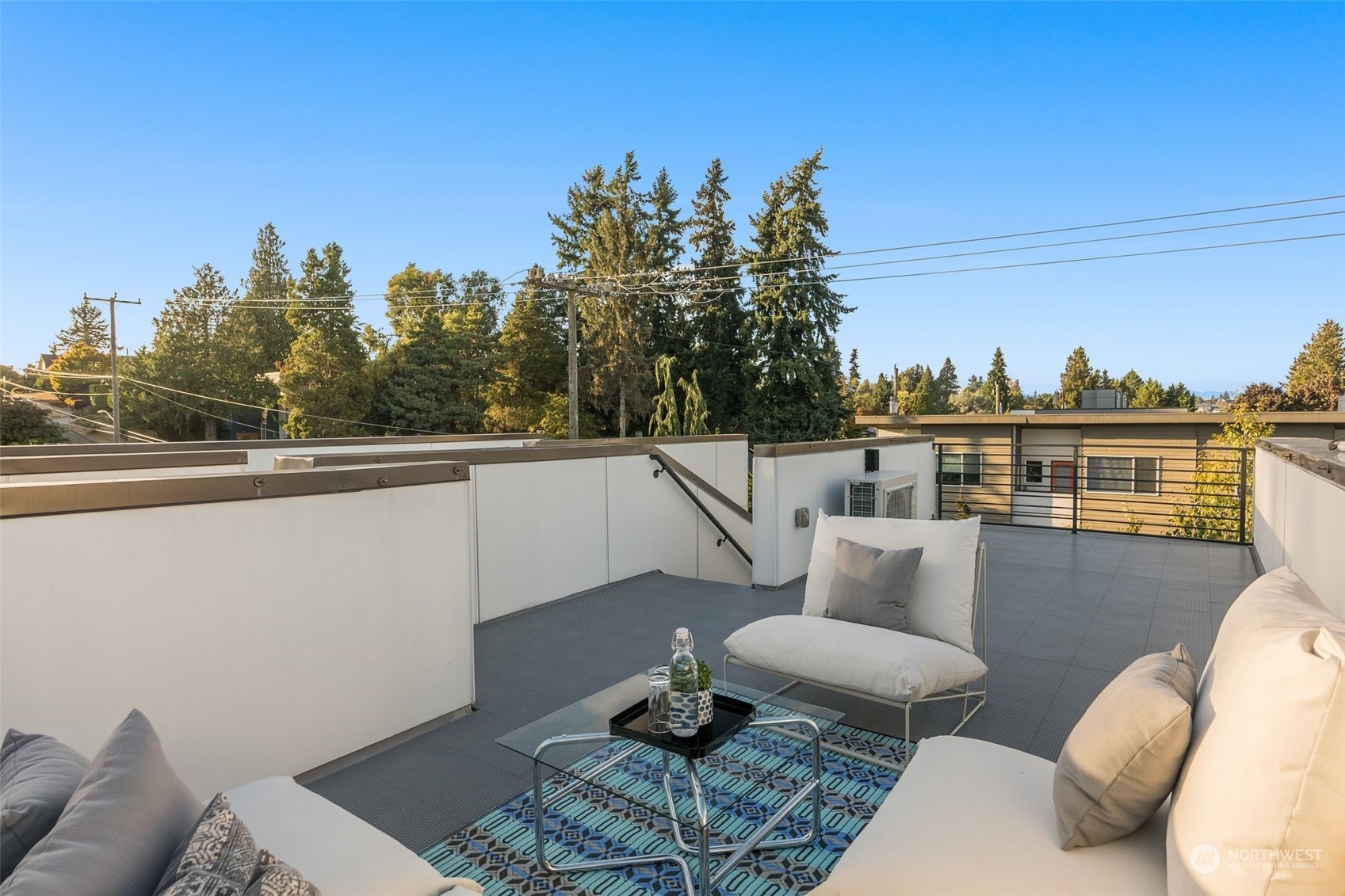 3909 Southwest Findlay Street Seattle, WA 98136 - Photo 27 of 32 a balcony with table and chairs