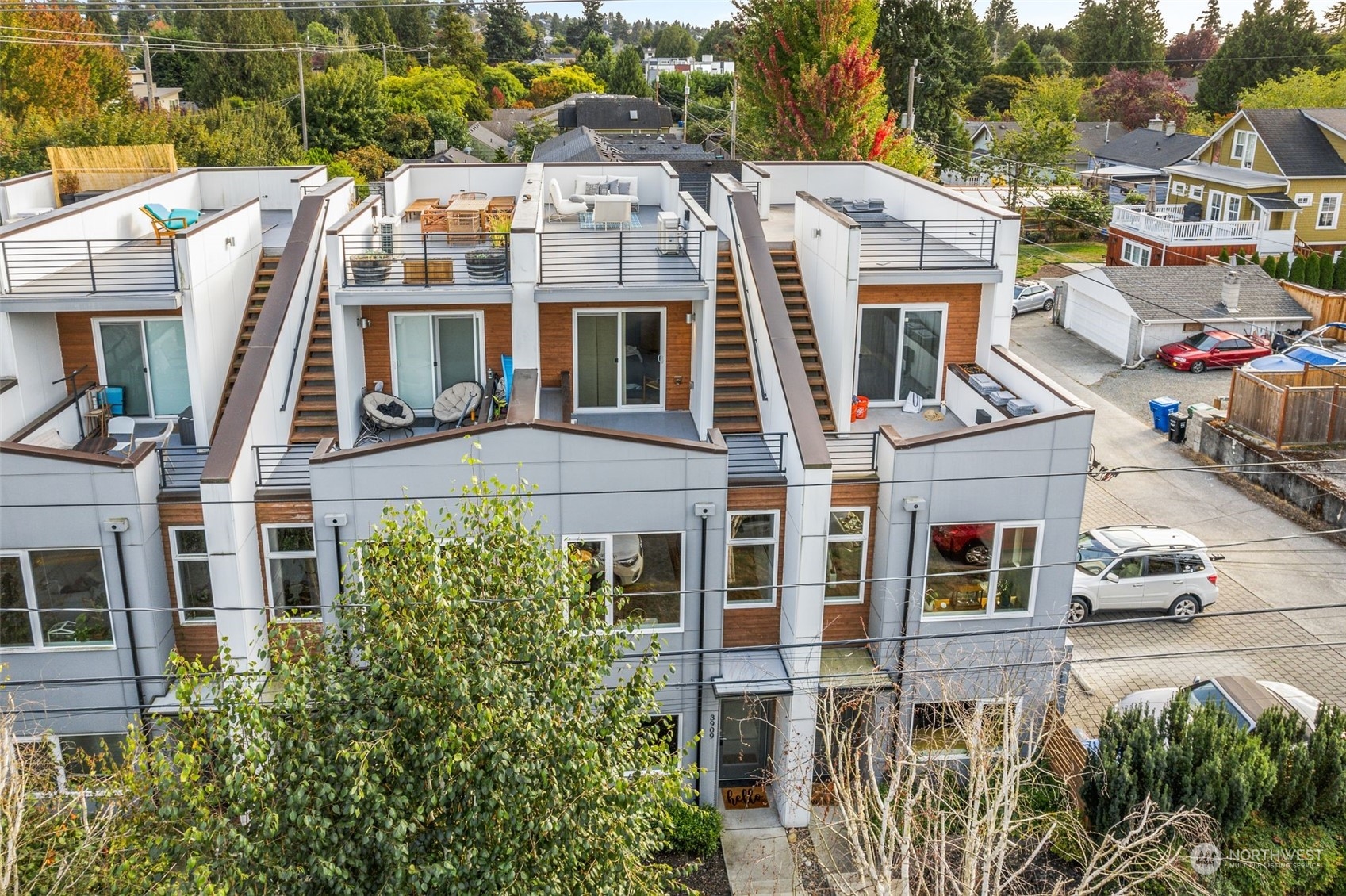3909 Southwest Findlay Street Seattle, WA 98136 - Photo 29 of 32 a front view of a residential apartment building with a yard