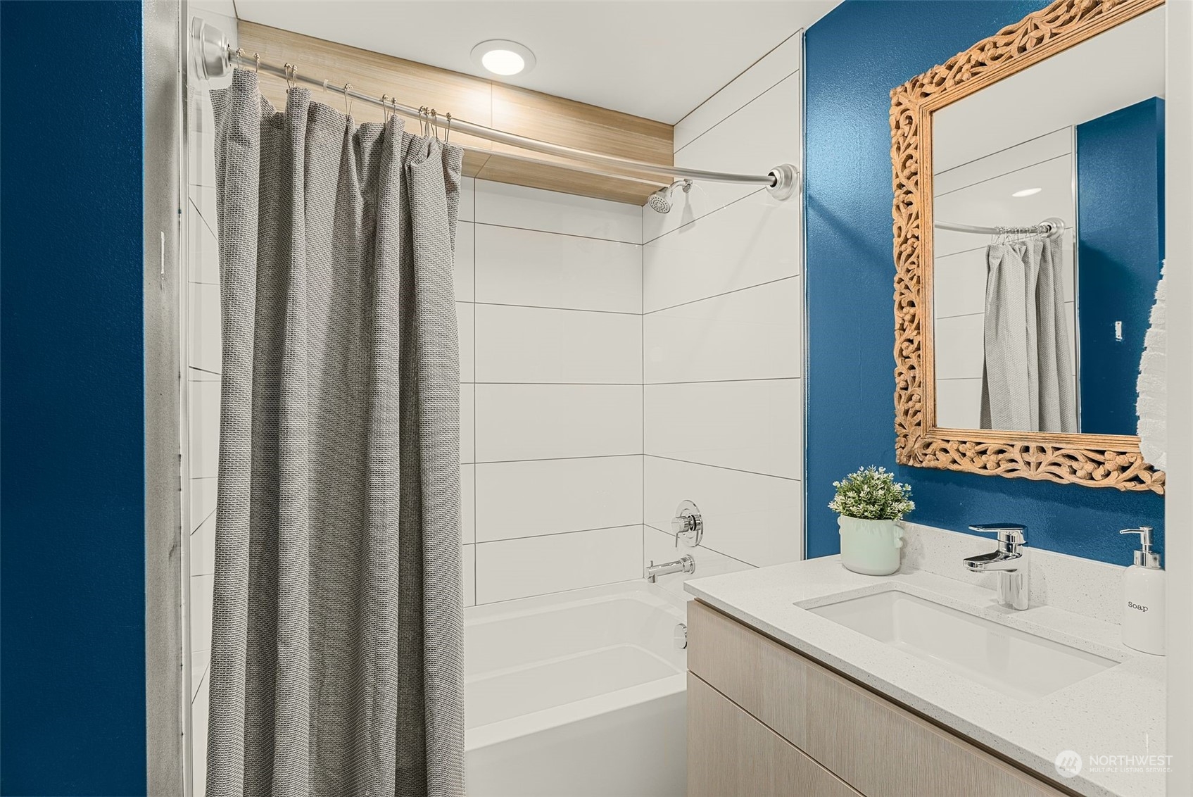 3909 Southwest Findlay Street Seattle, WA 98136 - Photo 7 of 32 a bathroom with a sink and a mirror