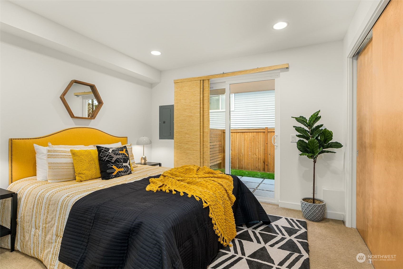 3909 Southwest Findlay Street Seattle, WA 98136 - Photo 8 of 32 a bedroom with a bed and a potted plant