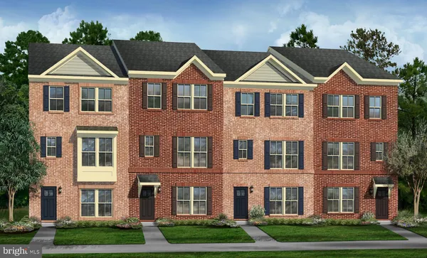 front view of a brick house next to a yard