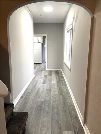 a view of wooden floor and windows in a room
