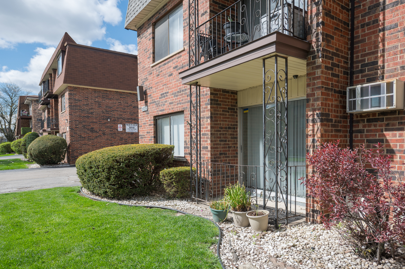 9830 Nottingham Avenue, Unit 1 Chicago Ridge, IL 60415 - Photo 3 of 16 a view of a brick house with a yard and plants