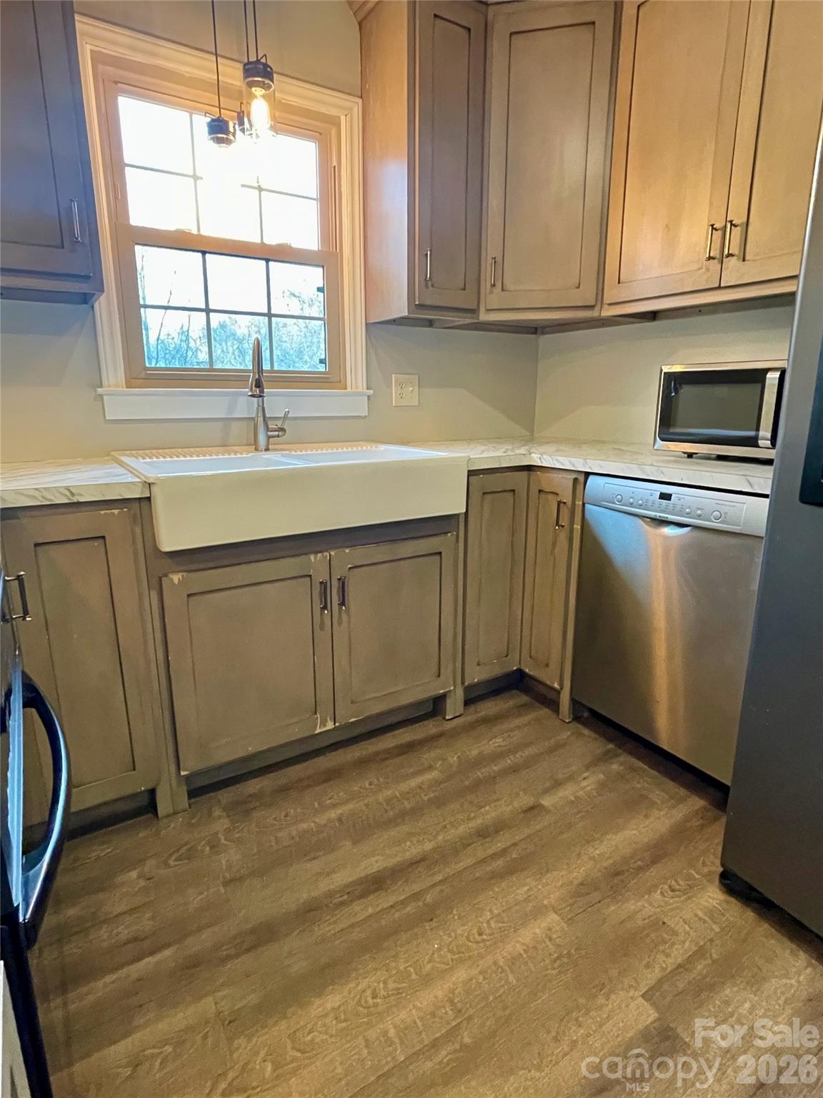 635 Powell Road Northeast Lenoir, NC 28645 - Photo 13 of 48 a kitchen with a sink cabinets and window