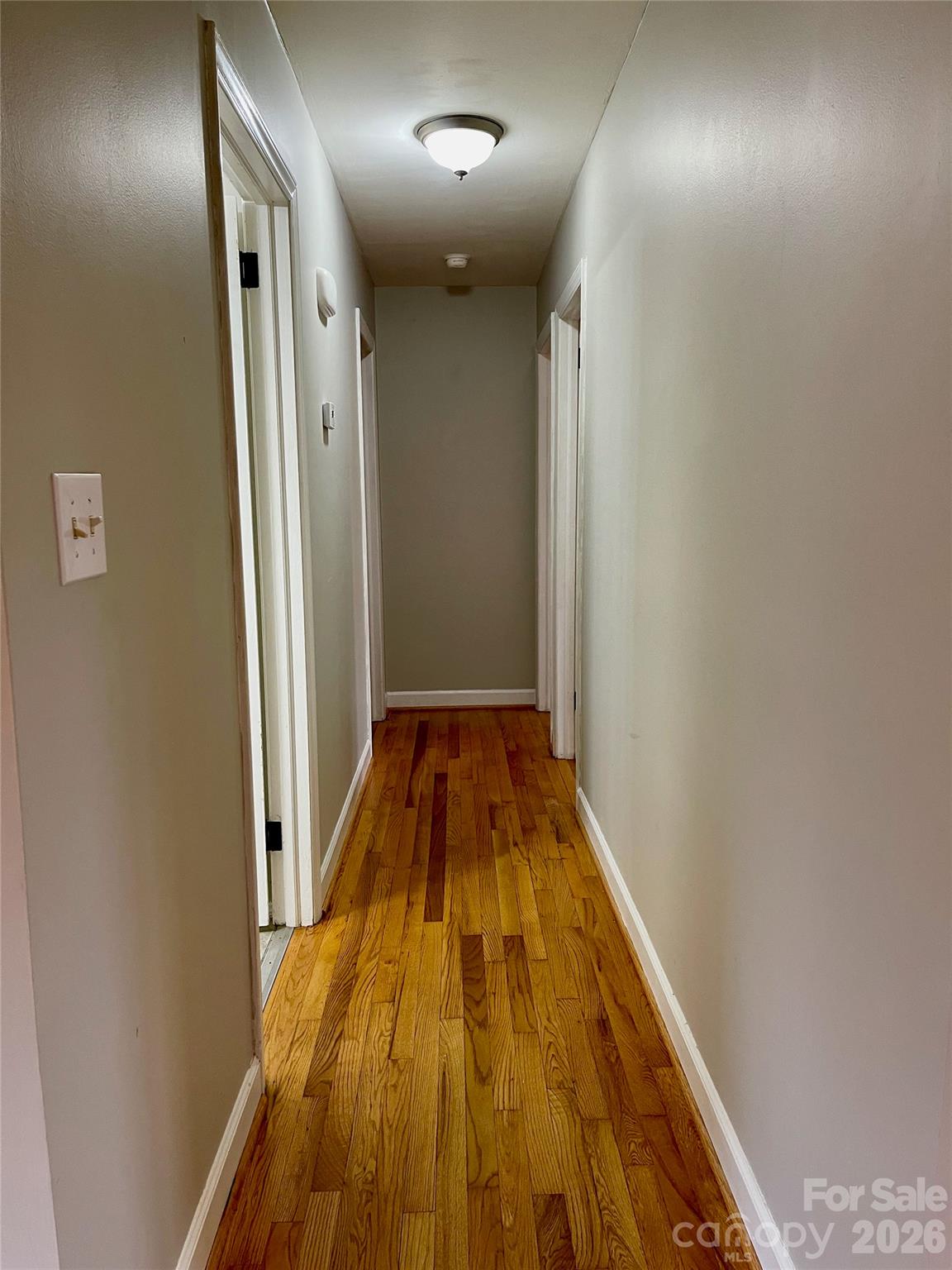 635 Powell Road Northeast Lenoir, NC 28645 - Photo 19 of 48 a view of a hallway with wooden floor