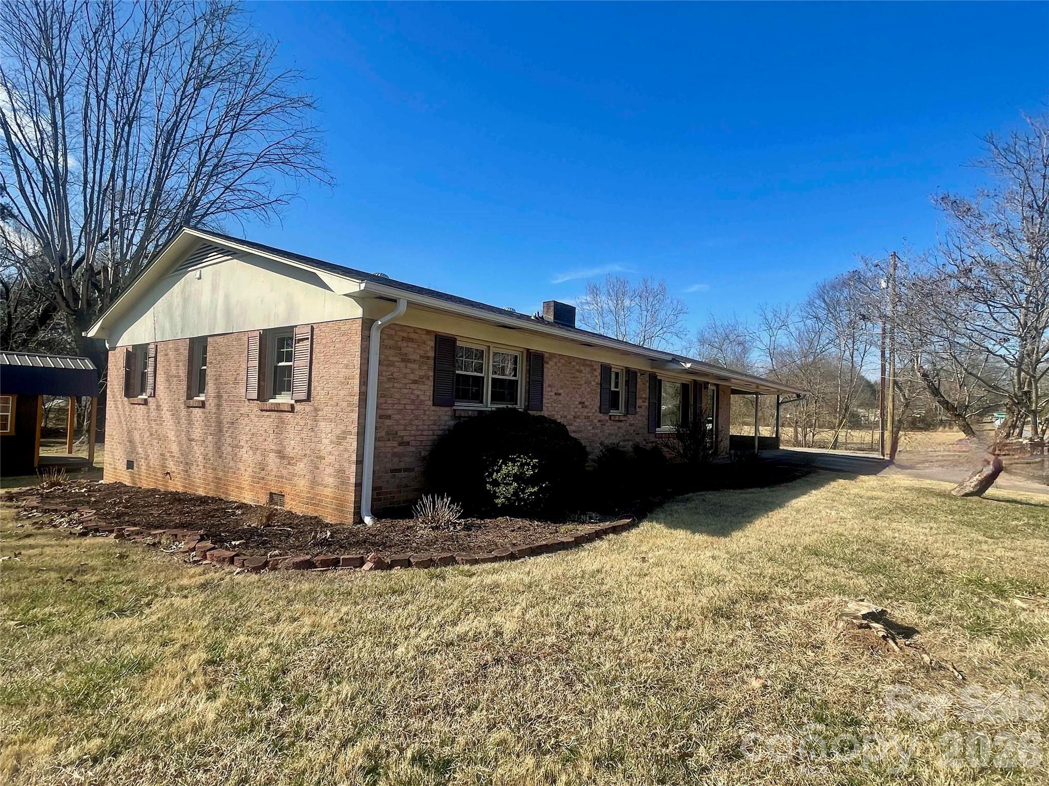 635 Powell Road Northeast Lenoir, NC 28645 - Photo 2 of 48 a view of a house with a yard