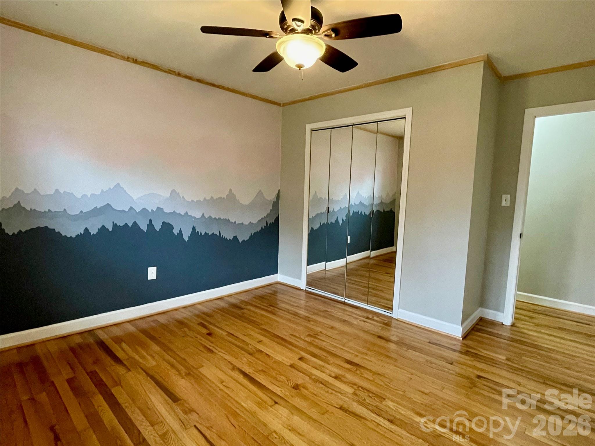 635 Powell Road Northeast Lenoir, NC 28645 - Photo 21 of 48 a view of a room with a ceiling fan
