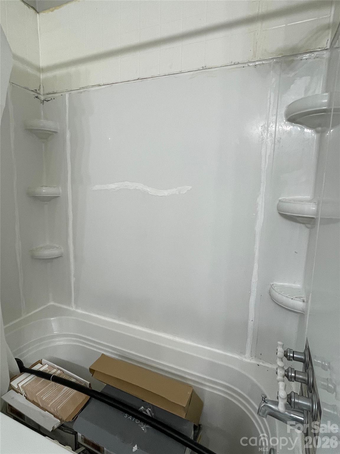 635 Powell Road Northeast Lenoir, NC 28645 - Photo 24 of 48 a bathroom with a shower and a toilet