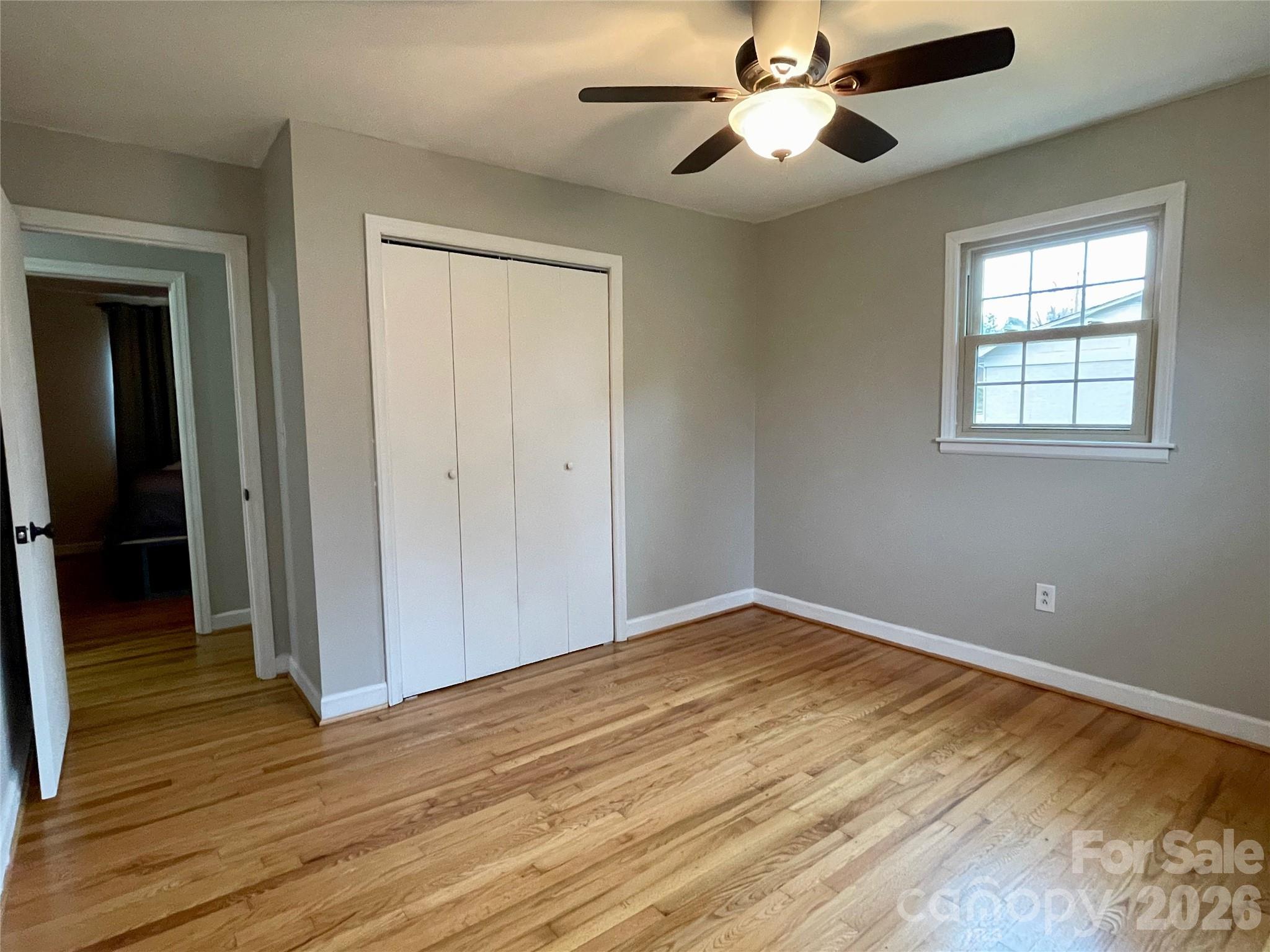 635 Powell Road Northeast Lenoir, NC 28645 - Photo 25 of 48 a view of empty room with wooden floor and fan