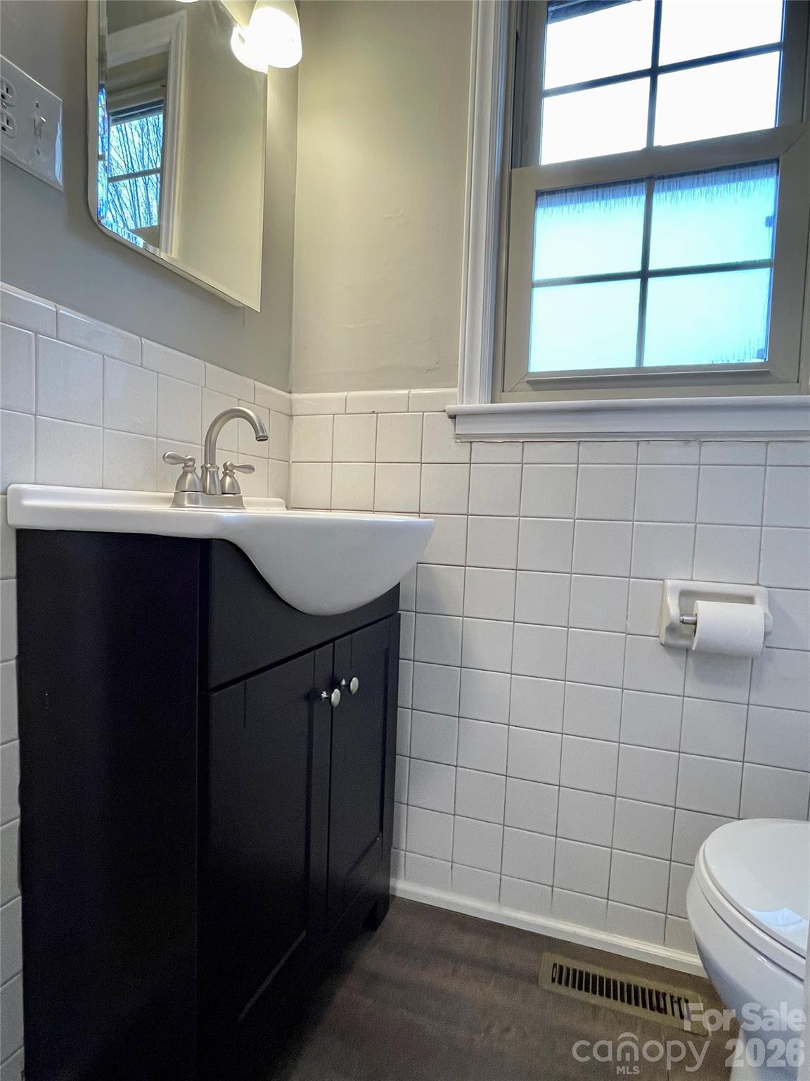 635 Powell Road Northeast Lenoir, NC 28645 - Photo 31 of 48 a bathroom with a sink and a toilet