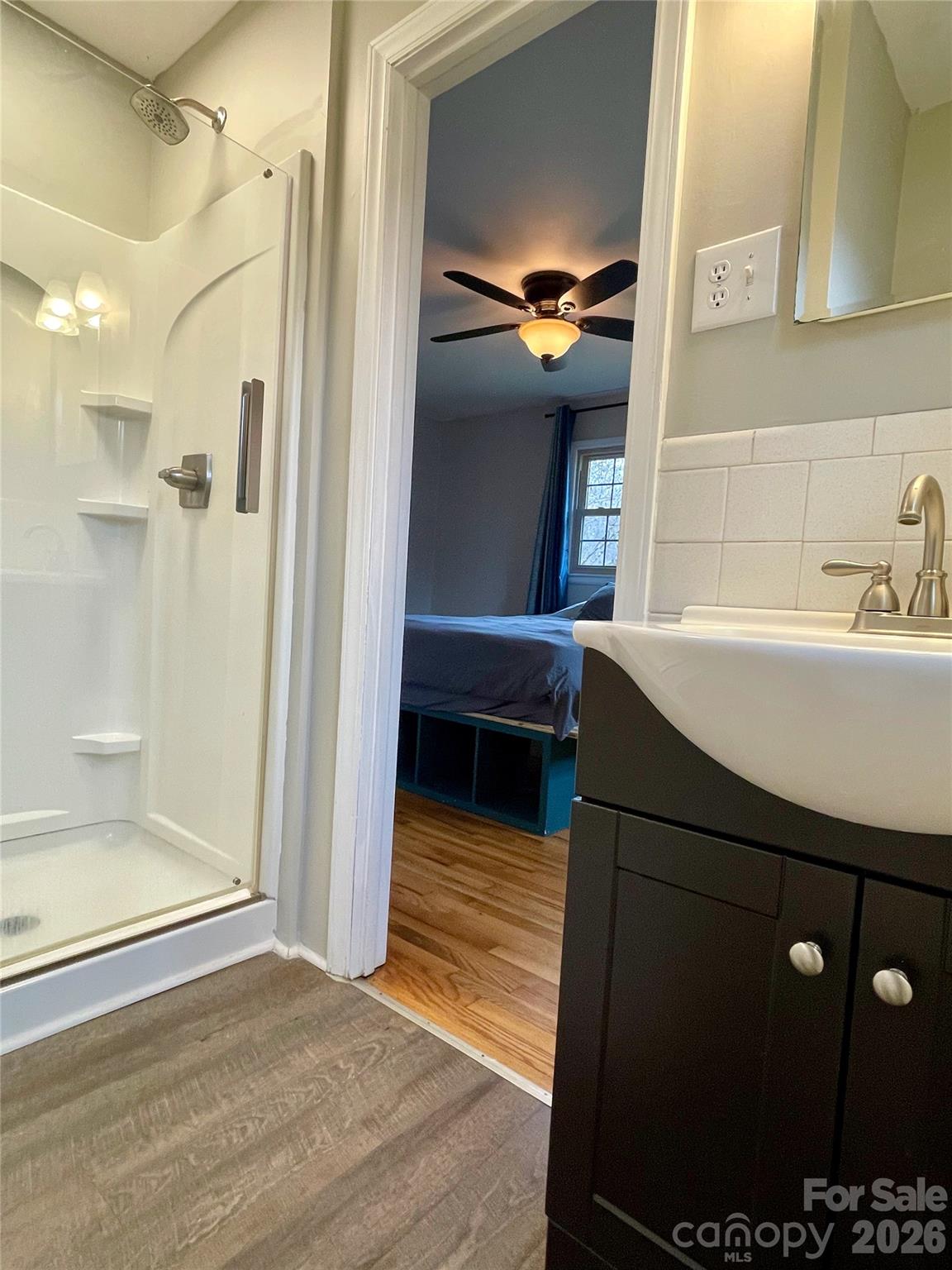 635 Powell Road Northeast Lenoir, NC 28645 - Photo 32 of 48 a bathroom with a sink and a mirror