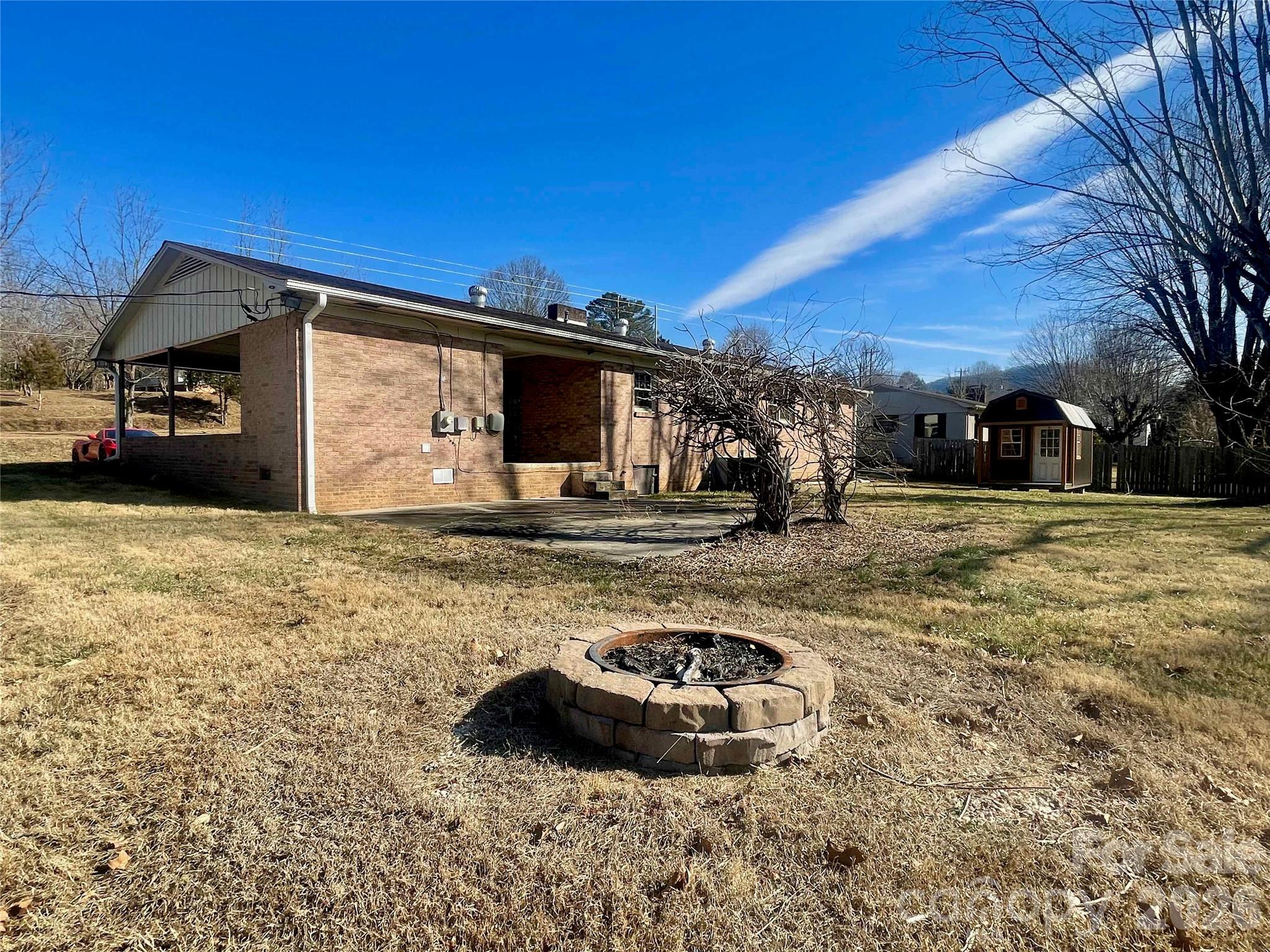 635 Powell Road Northeast Lenoir, NC 28645 - Photo 39 of 48 a view of a car parked in front of a house