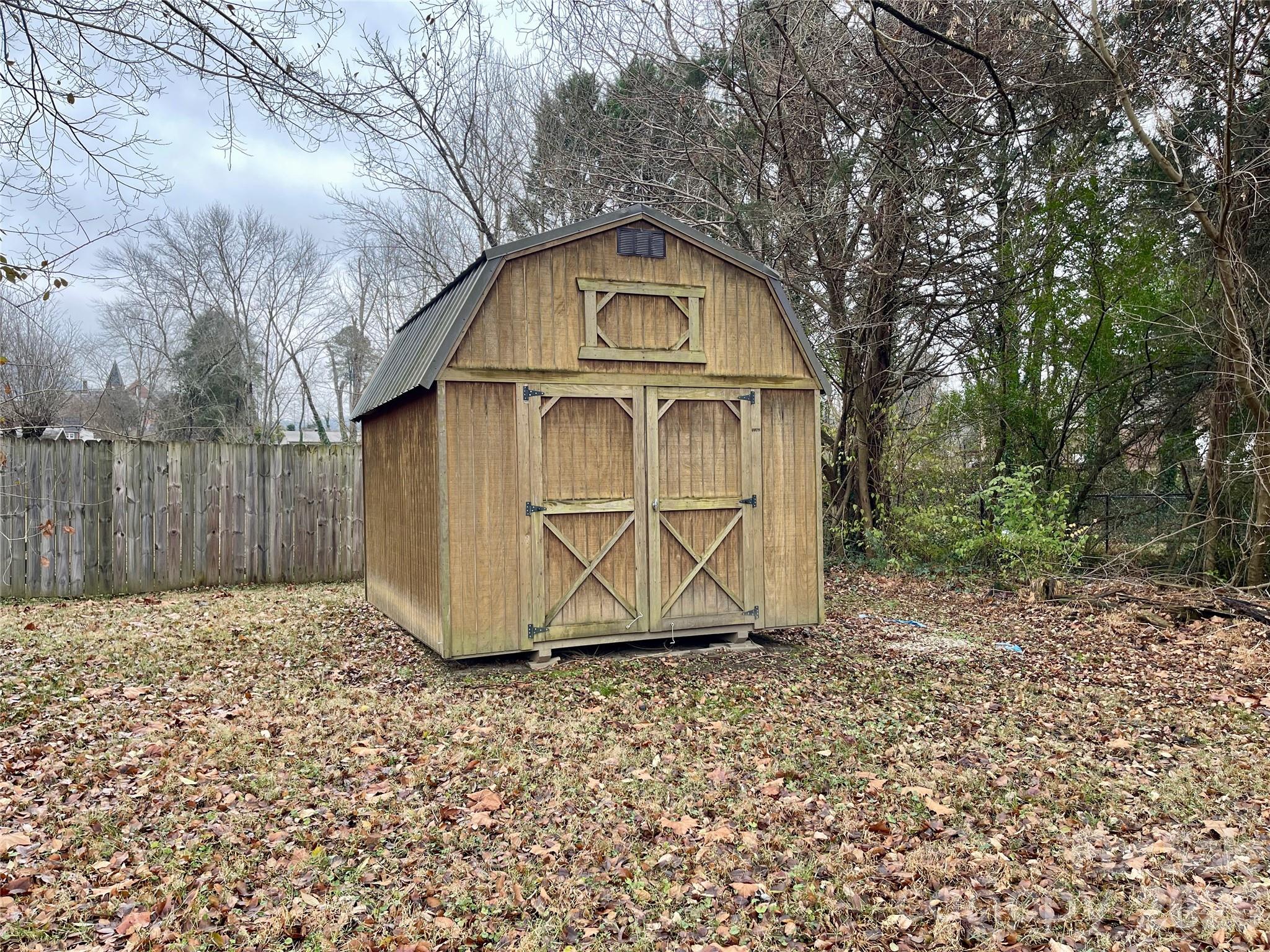 635 Powell Road Northeast Lenoir, NC 28645 - Photo 44 of 48 a view of a tiny house with a large trees