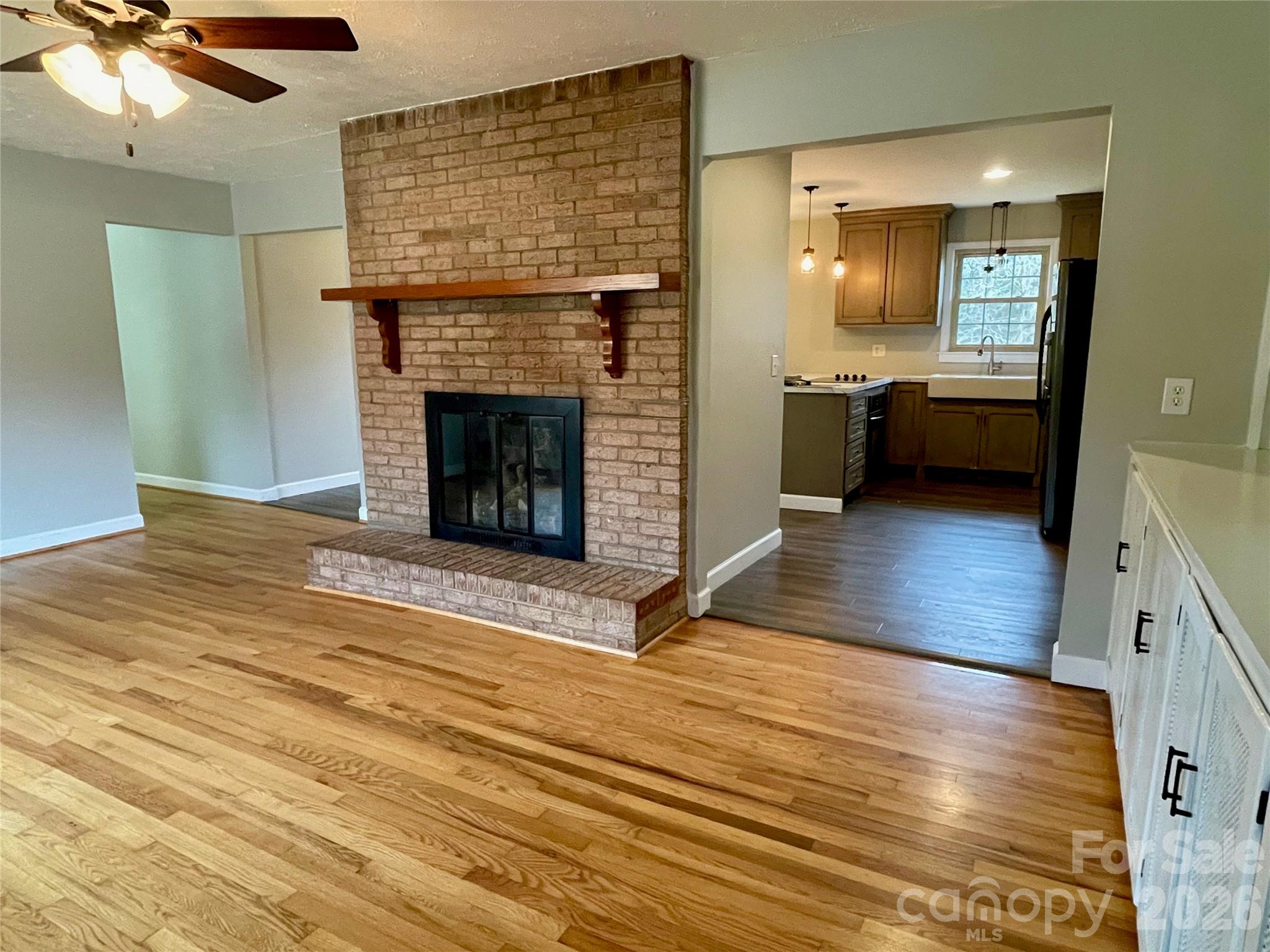 635 Powell Road Northeast Lenoir, NC 28645 - Photo 6 of 48 a view of a kitchen cabinets and a fireplace