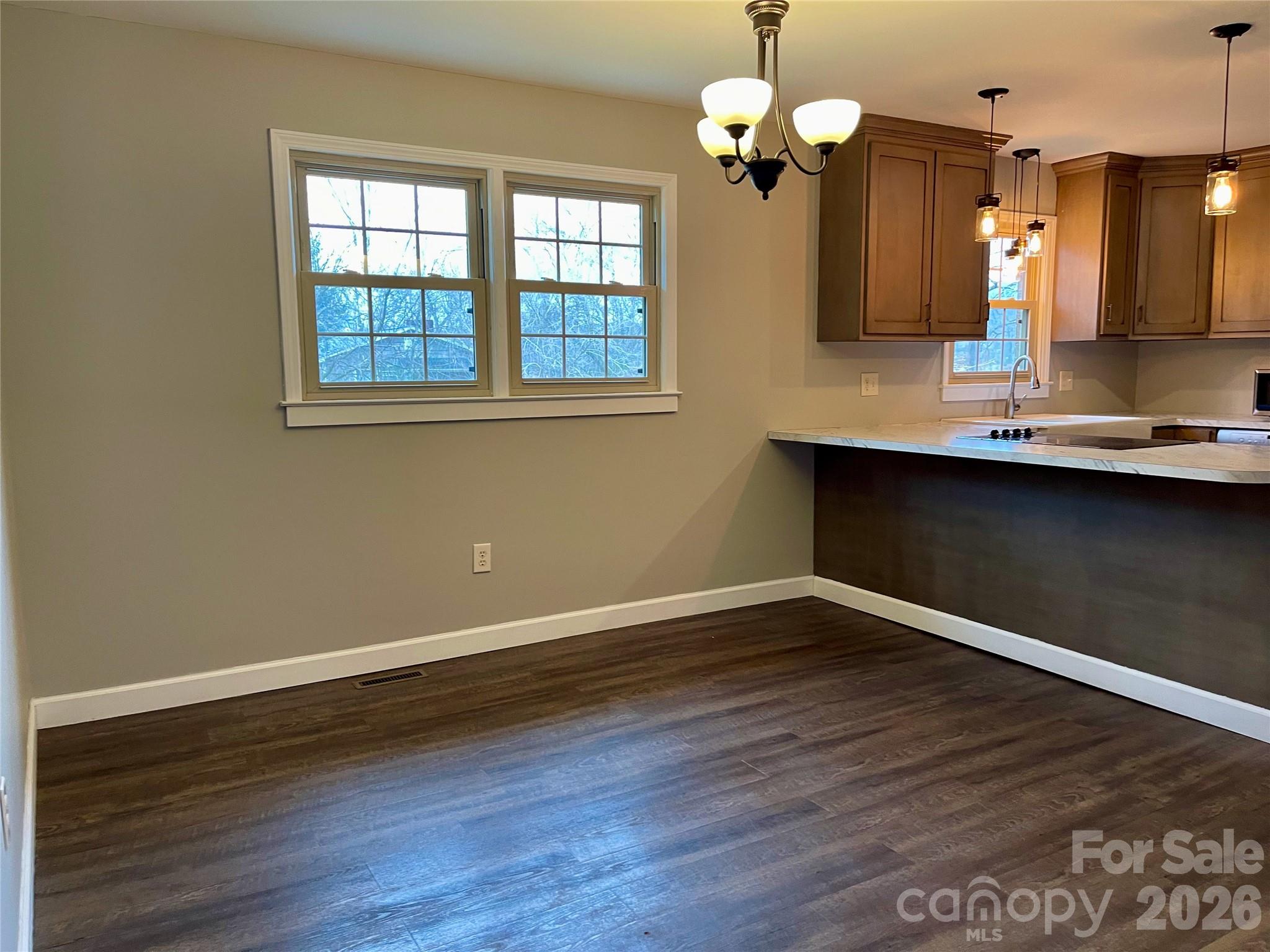 635 Powell Road Northeast Lenoir, NC 28645 - Photo 8 of 48 a view of a room with wooden floor and a window