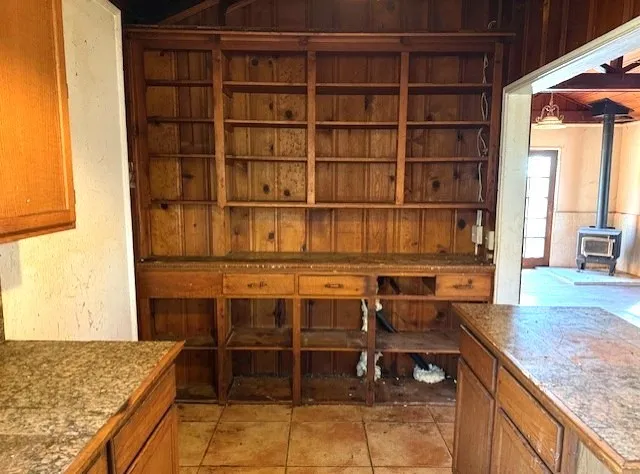 a kitchen with a sink and a wooden cabinets