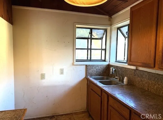 a kitchen with a sink and a window