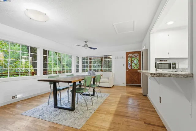 a dining room with table and chairs