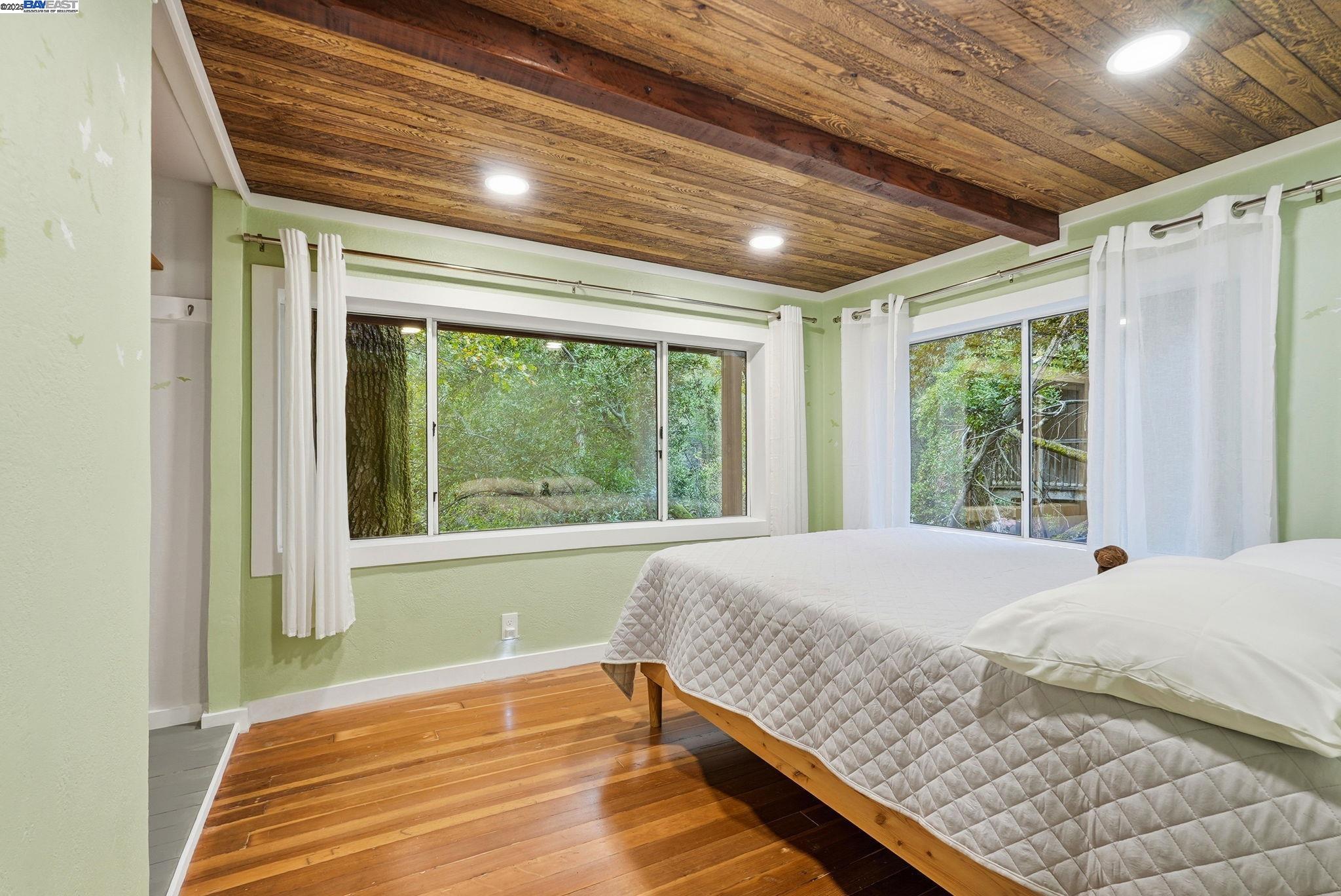 2929 Kilkare Road Sunol, CA 94586 - Photo 24 of 40 a bedroom with a large bed and a large window with outer view