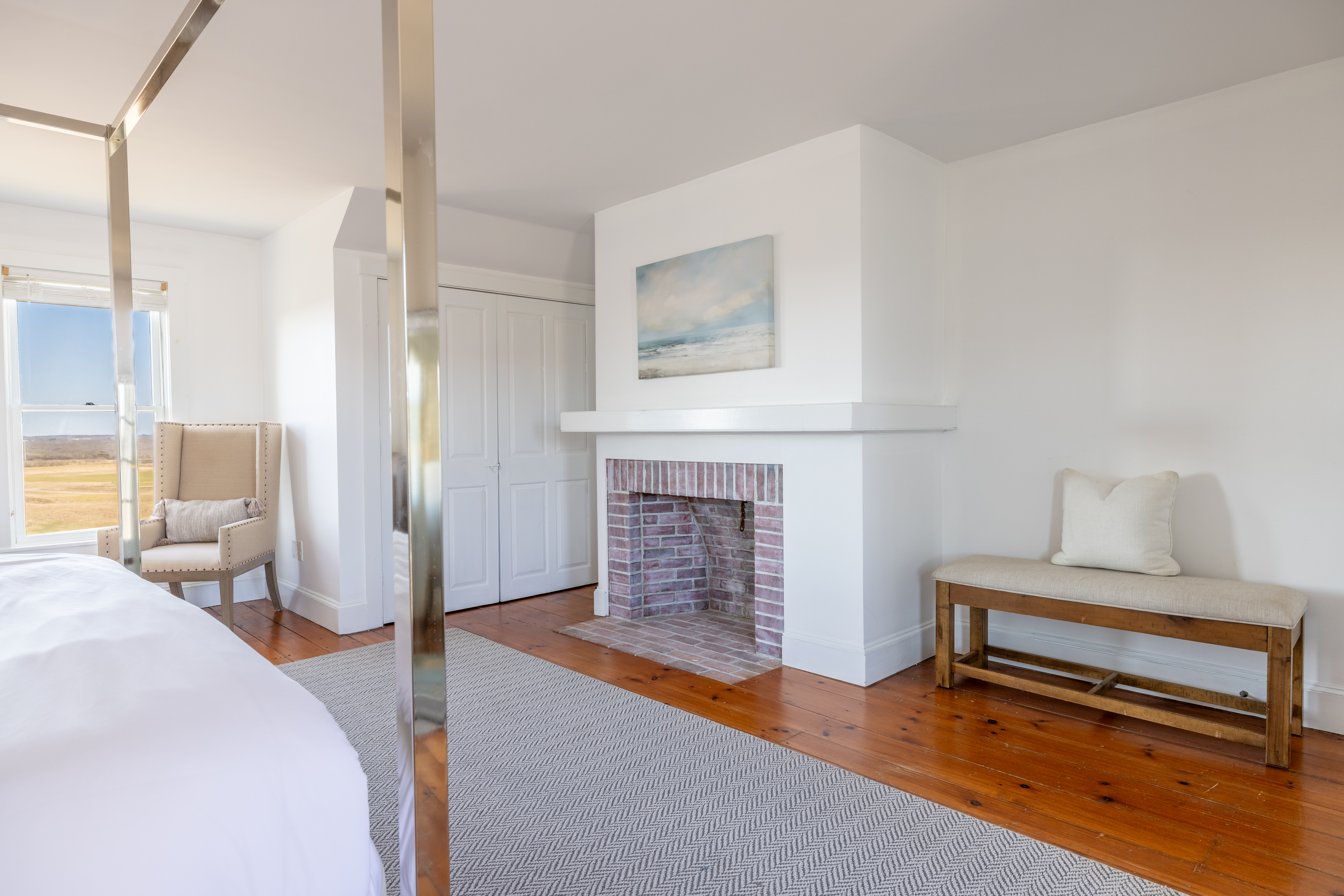 116 Baxter Road Nantucket, MA 02554 - Photo 12 of 28 a bedroom with furniture and a fireplace