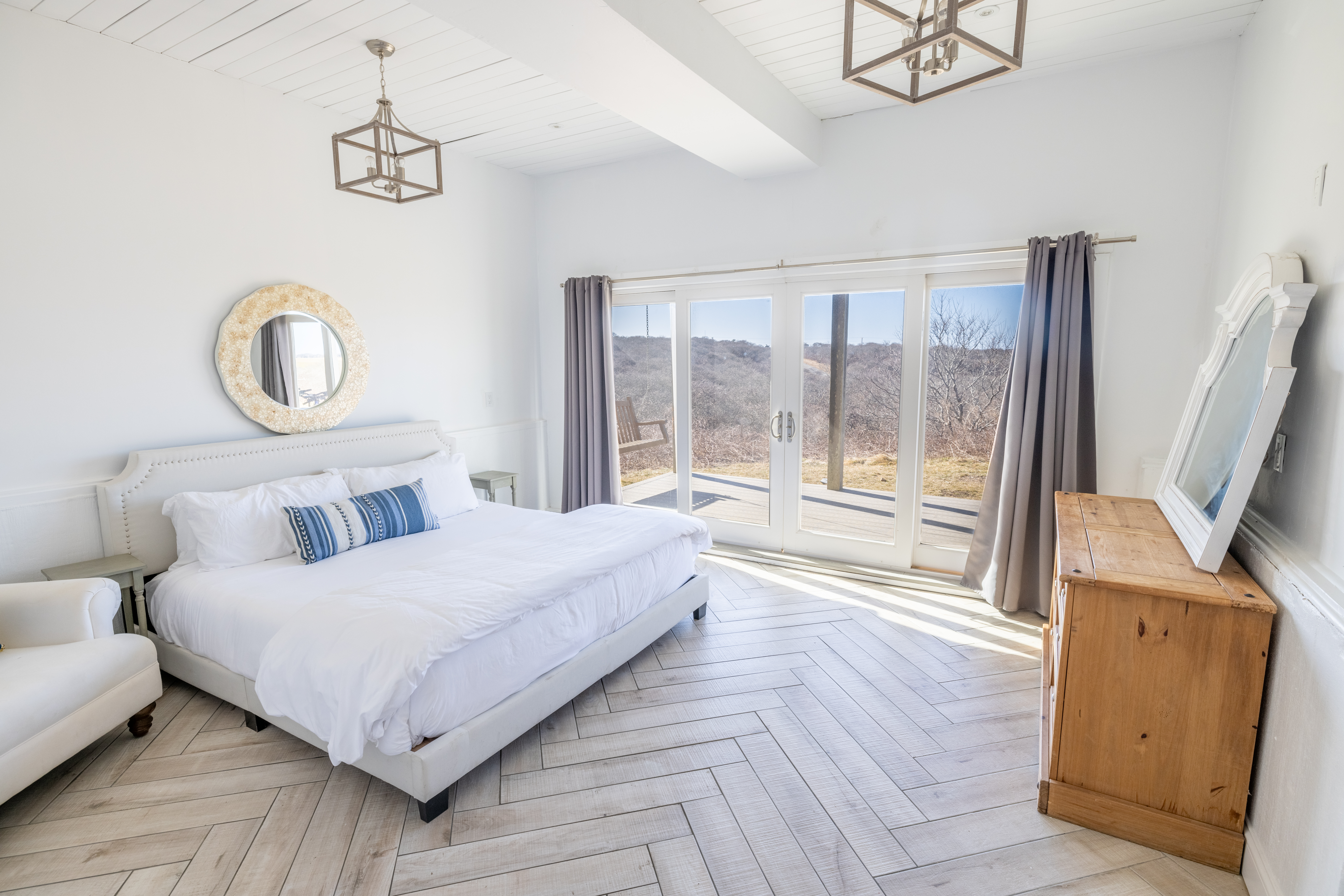 116 Baxter Road Nantucket, MA 02554 - Photo 18 of 28 a bedroom with a bed and a flat screen tv