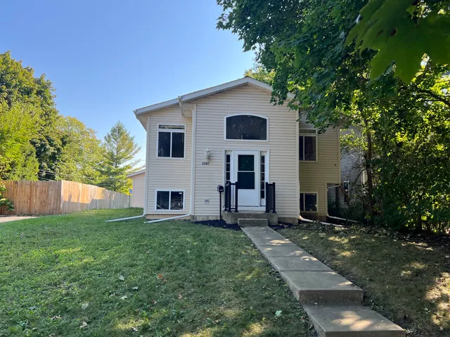 a view of a house with a yard