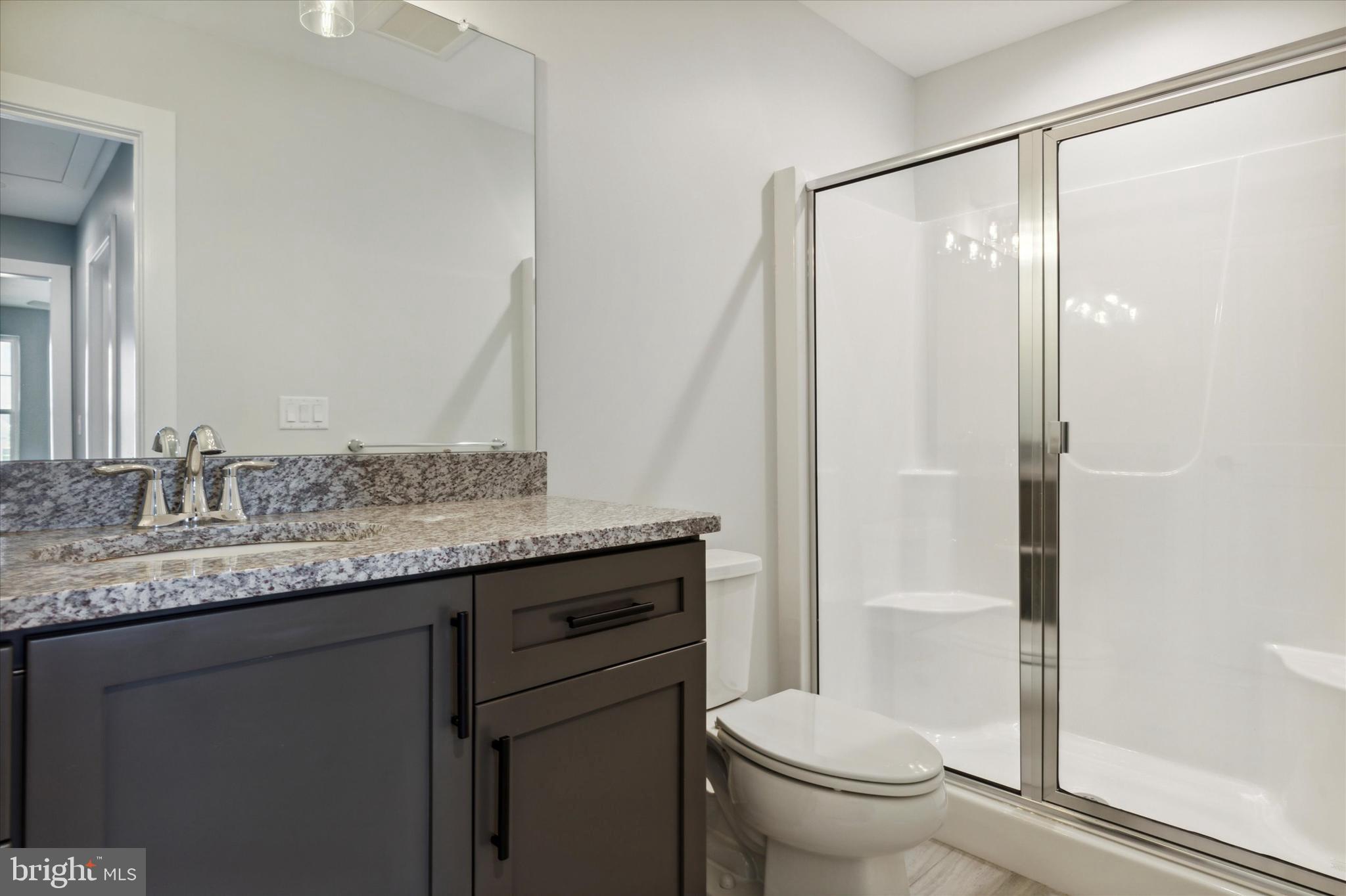 124 Schultz Road Sellersville, PA 18960 - Photo 24 of 29 a bathroom with a granite countertop sink toilet and shower