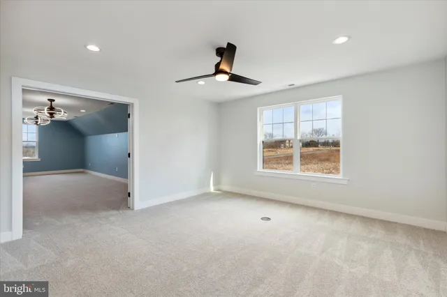 a bathroom with a granite countertop sink a toilet and bathtub