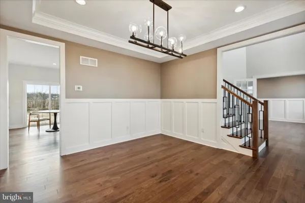 a view of entryway with wooden floor