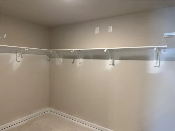 a view of a room with racks on the wall