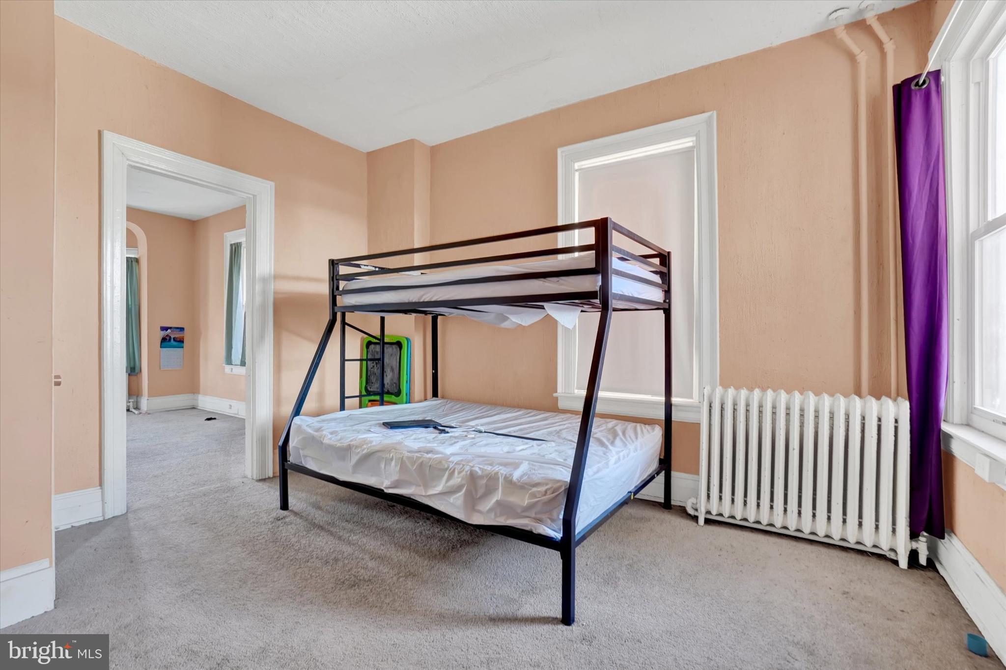 1323 North George Street York, PA 17404 - Photo 13 of 27 a bedroom with a bed and a window