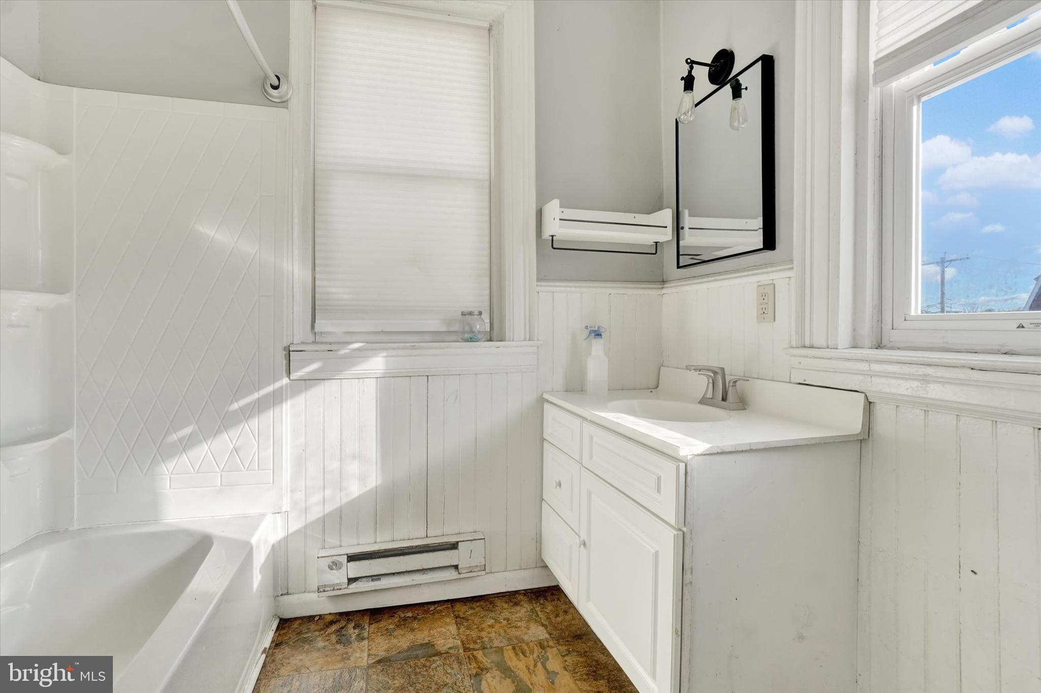 1323 North George Street York, PA 17404 - Photo 17 of 27 a bathroom with a sink and a bathtub