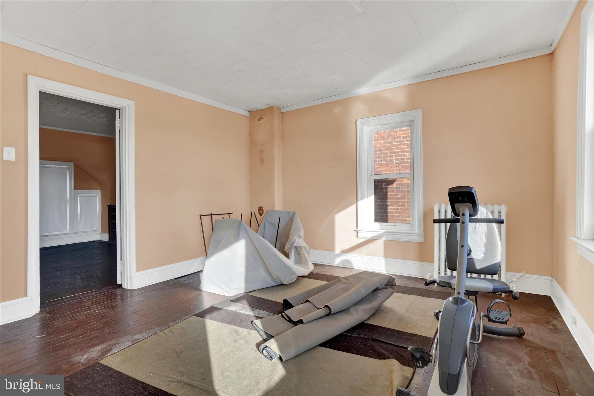 1323 North George Street York, PA 17404 - Photo 20 of 27 a view of a workspace with furniture and wooden floor