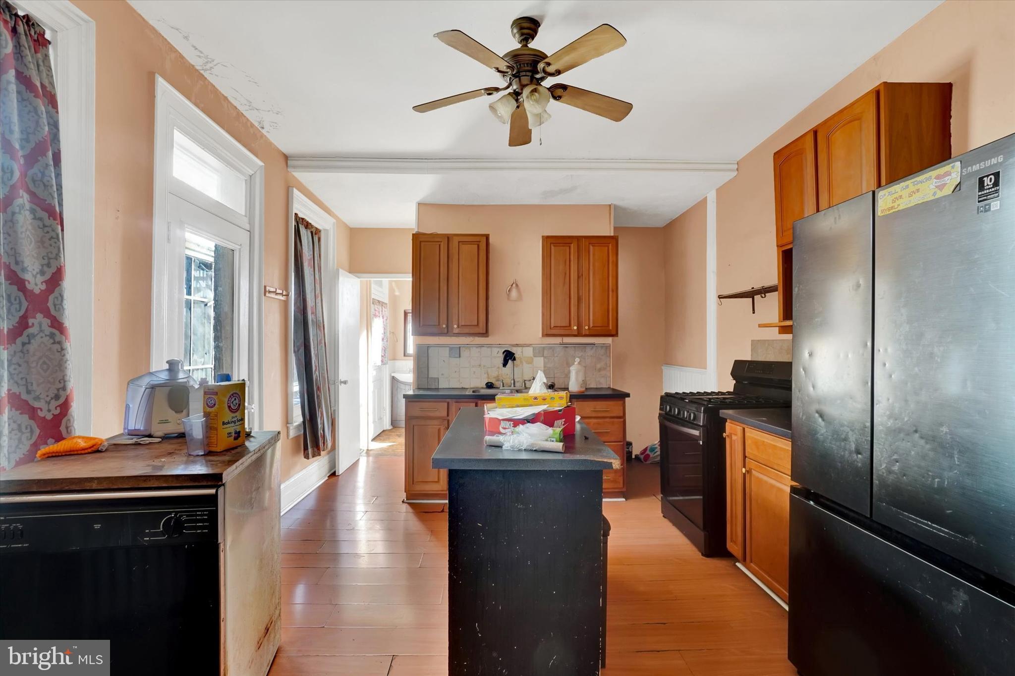 1323 North George Street York, PA 17404 - Photo 7 of 27 a kitchen with stainless steel appliances granite countertop a refrigerator a stove and a sink with dishwasher