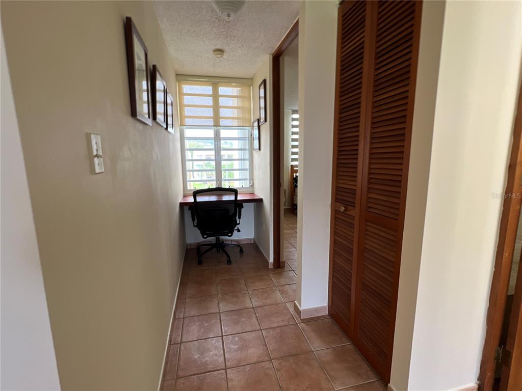 968 Camino Las Picüas, Unit 30 Rio Grande, Río Grande 00745 - Photo 17 of 24 a view of workspace with furniture and a window