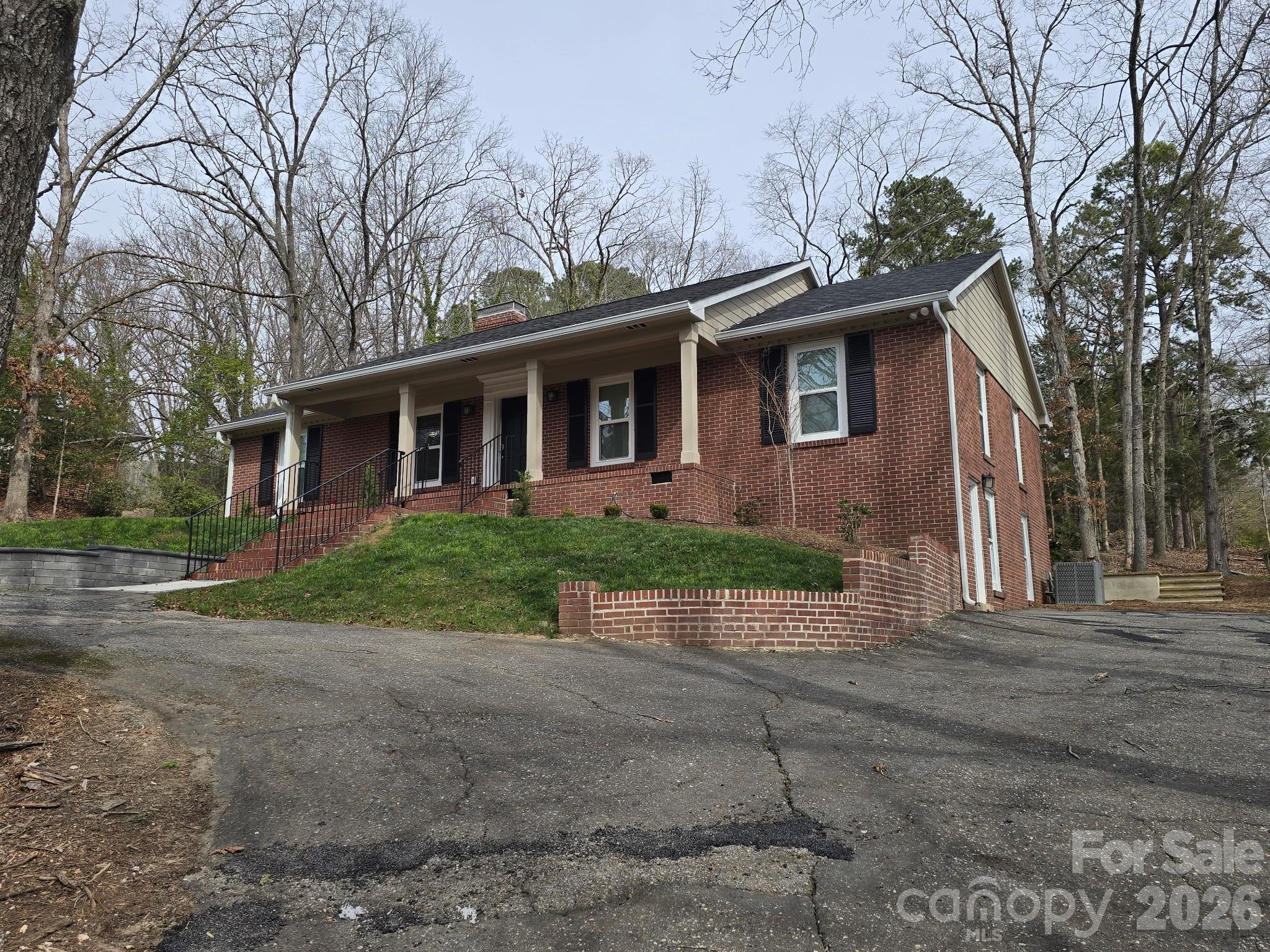 126 Sunset Drive Chester, SC 29706 - Photo 2 of 31 a front view of a house with a yard and potted plants