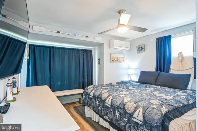 a bedroom with a large bed and a window