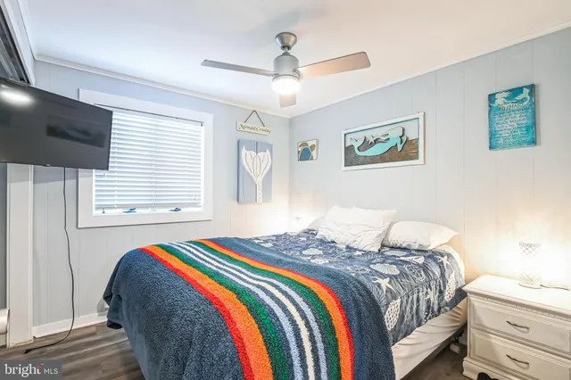 a bedroom with bed and a window