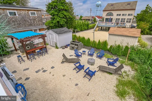 a view of a backyard with sitting area