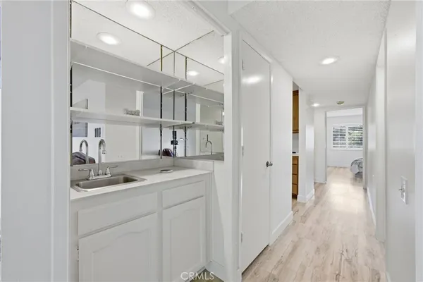 a bathroom with a sink a vanity and a mirror
