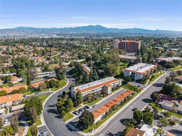 an aerial view of residential houses with outdoor space