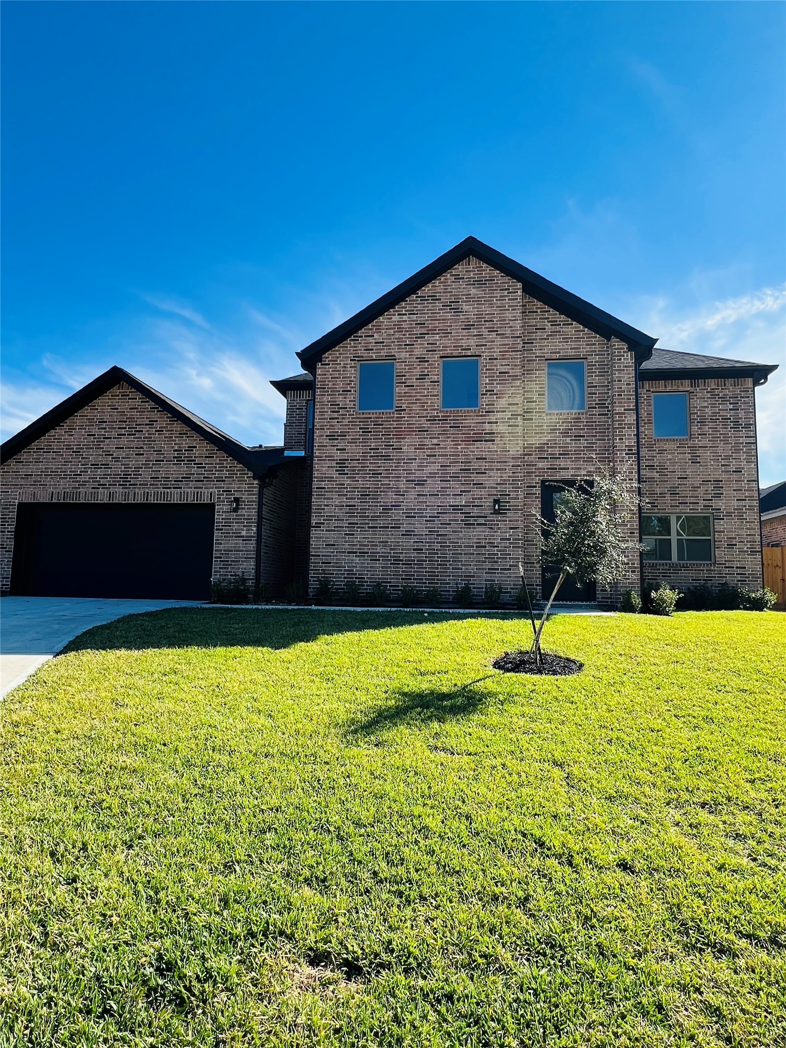 a brick house with a yard