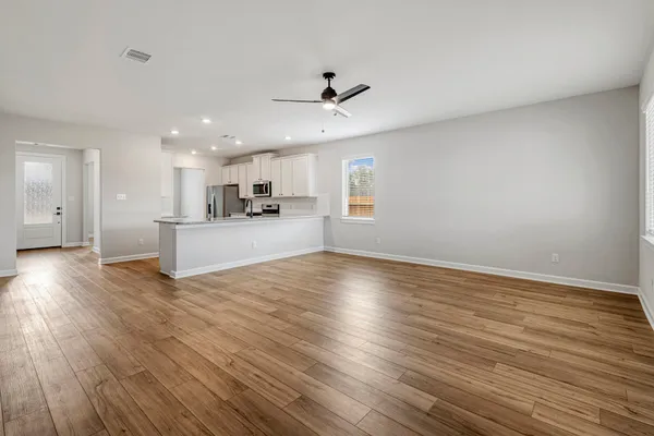 a view of kitchen with wooden floor and window
