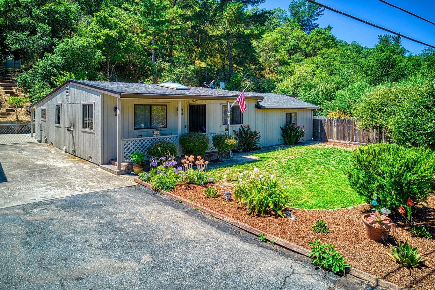 19220 Mallory Canyon Road Salinas, CA 93907 - Photo 1 of 29 a front view of a house with a yard and a garden