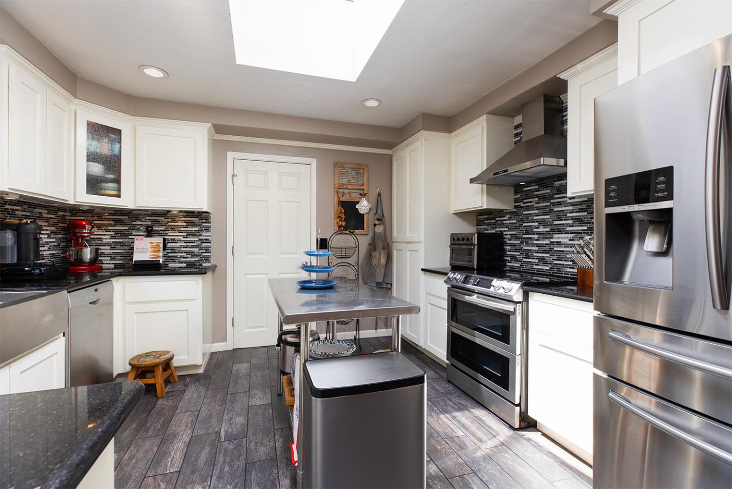 19220 Mallory Canyon Road Salinas, CA 93907 - Photo 15 of 29 a kitchen with stainless steel appliances kitchen island granite countertop a stove a sink and a refrigerator